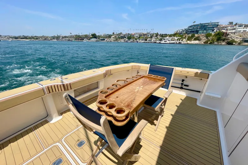 Slide: The Image of Luxury deck of 2005 Viking 48 Convertible yacht with ocean view and elegant seating. - 45