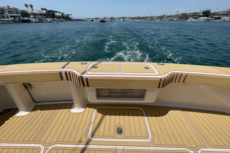 Slide: The Image of 2005 Viking 48 Convertible yacht deck with ocean view and wake trail. - 46