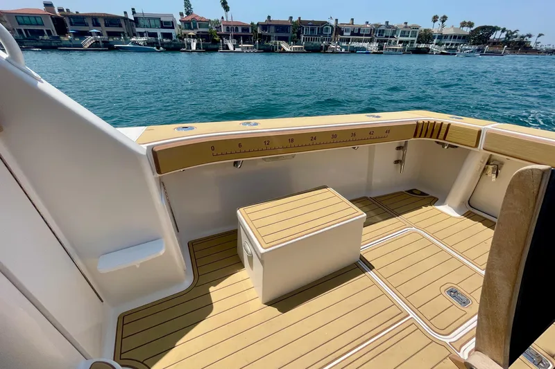 Slide: The Image of 2005 Viking 48 Convertible yacht deck with scenic waterfront view. - 47