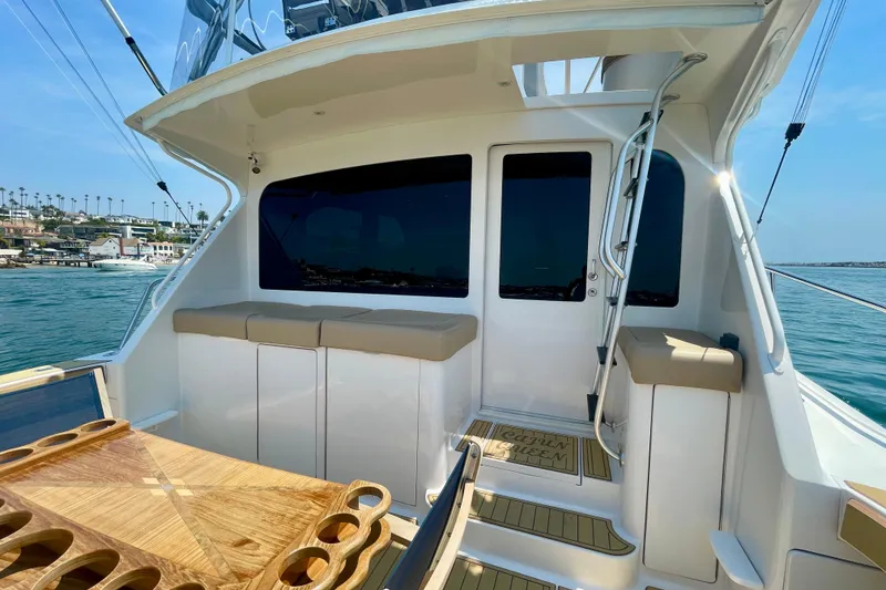 Slide: The Image of 2005 Viking 48 Convertible yacht interior with seating and ocean view. - 48