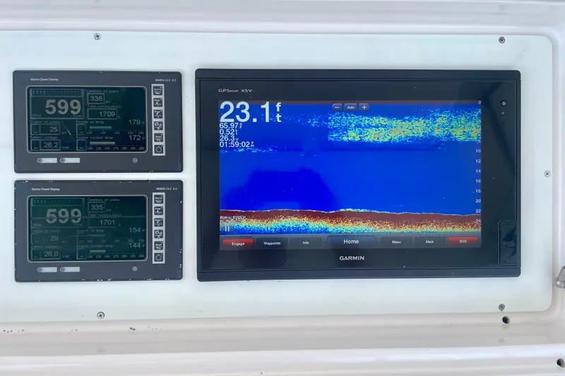 Slide: The Image of Marine navigation display on 2005 Viking 48 Convertible, featuring Garmin GPS and engine monitors. - 52