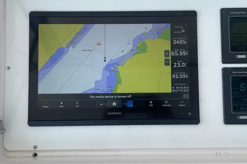 Slide: The Image of Garmin navigation display on 2005 Viking 48 Convertible boat, showing map and data. - 53