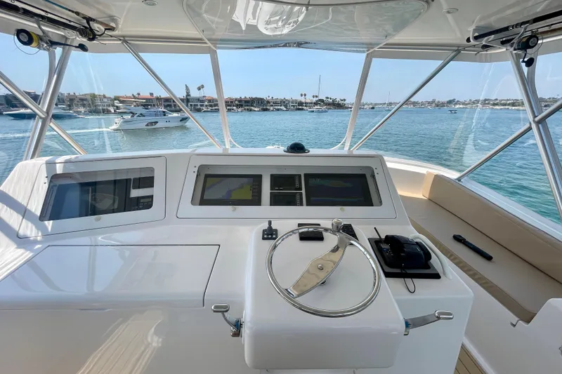 Slide: The Image of 2005 Viking 48 Convertible yacht helm with navigation screens and ocean view. - 55
