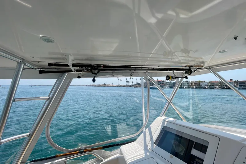 Slide: The Image of Interior view of 2005 Viking 48 Convertible yacht overlooking calm waters. - 57