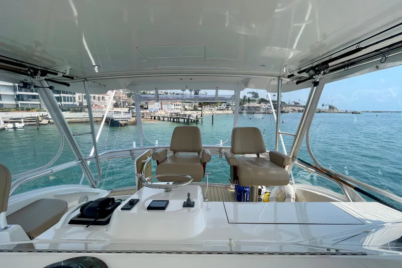 Slide: The Image of 2005 Viking 48 Convertible yacht interior with ocean view and modern controls. - 59