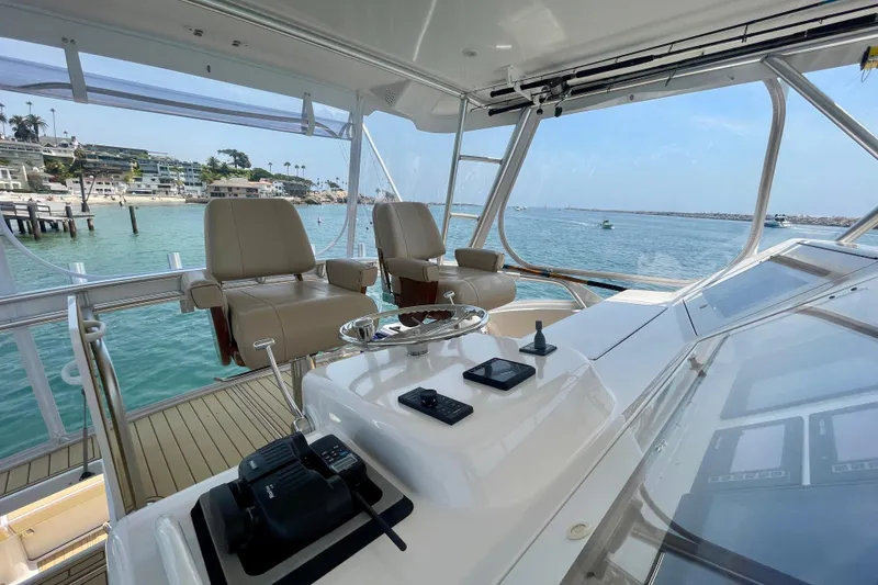 Slide: The Image of Interior view of 2005 Viking 48 Convertible yacht with ocean backdrop. - 60