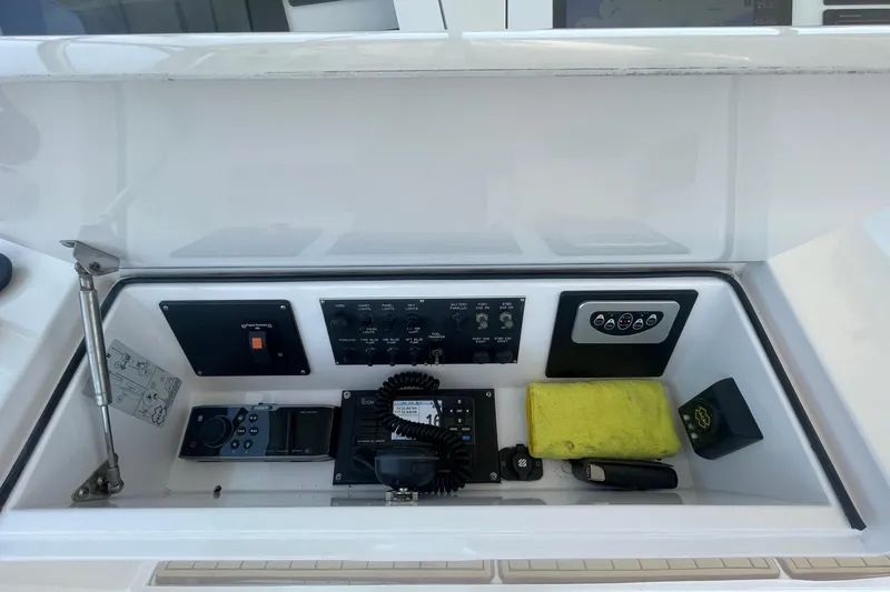 Slide: The Image of Control panel of a 2005 Viking 48 Convertible yacht with various instruments. - 67