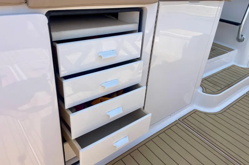 Slide: The Image of Open storage drawers on a 2005 Viking 48 Convertible yacht. - 69