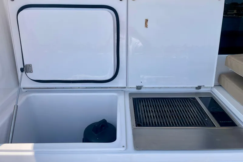 Slide: The Image of 2005 Viking 48 Convertible yacht with open storage and grill area. - 71