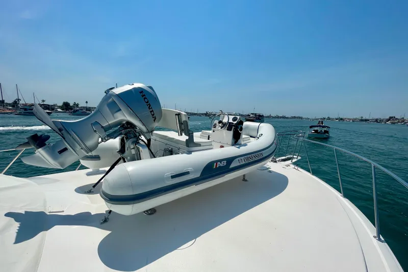 Slide: The Image of 2005 Viking 48 Convertible yacht with a Honda-powered tender on deck. - 75