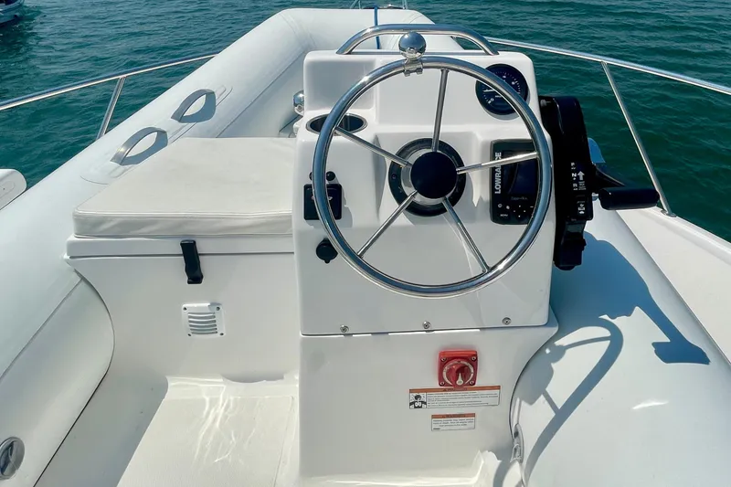 Slide: The Image of Helm of 2005 Viking 48 Convertible boat with steering wheel and controls. - 77
