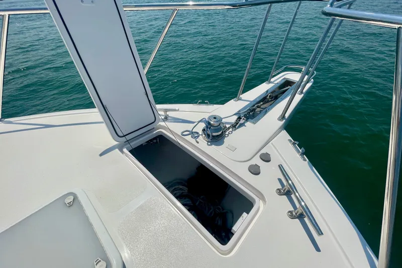 Slide: The Image of Open hatch on 2005 Viking 48 Convertible yacht deck, overlooking calm sea. - 79