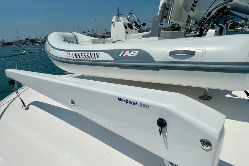 Slide: The Image of 2005 Viking 48 Convertible yacht with inflatable tender and MarQuipt 800 davit. - 80