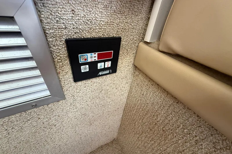 Slide: The Image of Control panel on 2004 Bayliner 285 boat interior, featuring temperature and fan settings. - 14