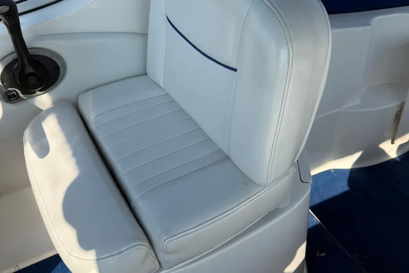 Slide: The Image of White leather seat on 2004 Bayliner 285 boat, featuring a sleek design. - 18