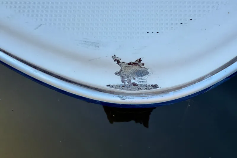 Slide: The Image of Damaged hull of 2004 Bayliner 285 boat above water surface. - 4