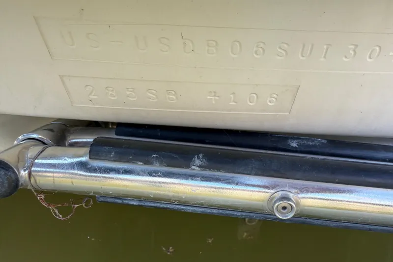 Slide: The Image of 2004 Bayliner 285 boat hull identification number and metal fittings. - 5