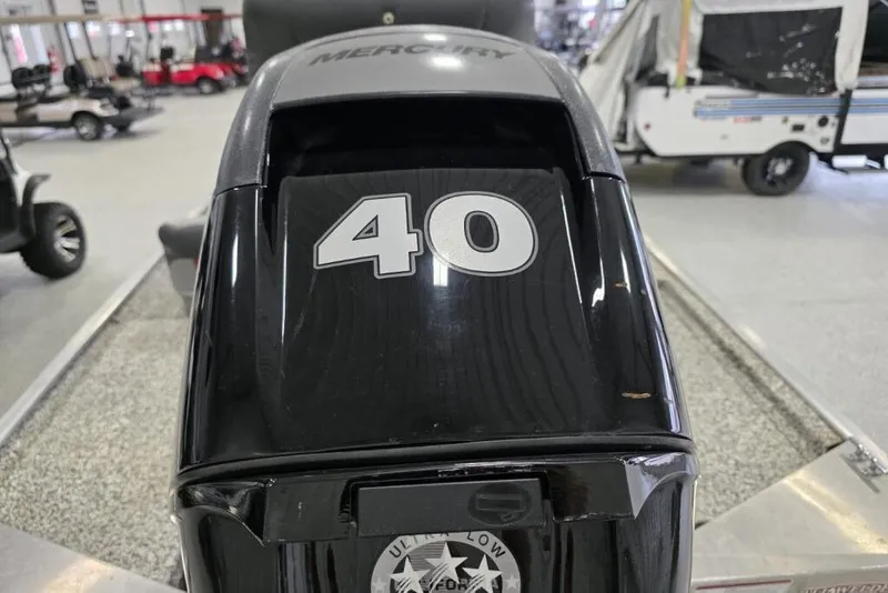 Slide: The Image of 2016 Tracker Pro 160 boat with Mercury 40 horsepower engine in showroom. - 6