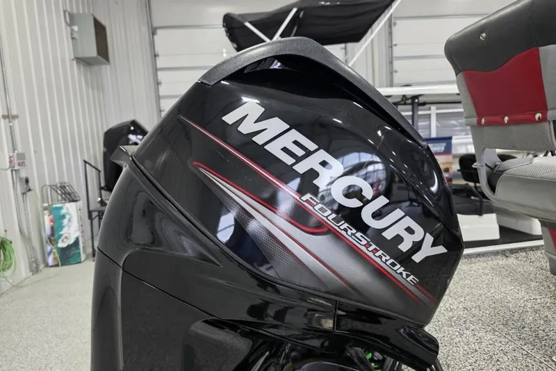 Slide: The Image of Mercury FourStroke engine on 2016 Tracker Pro 160 boat in a garage setting. - 7