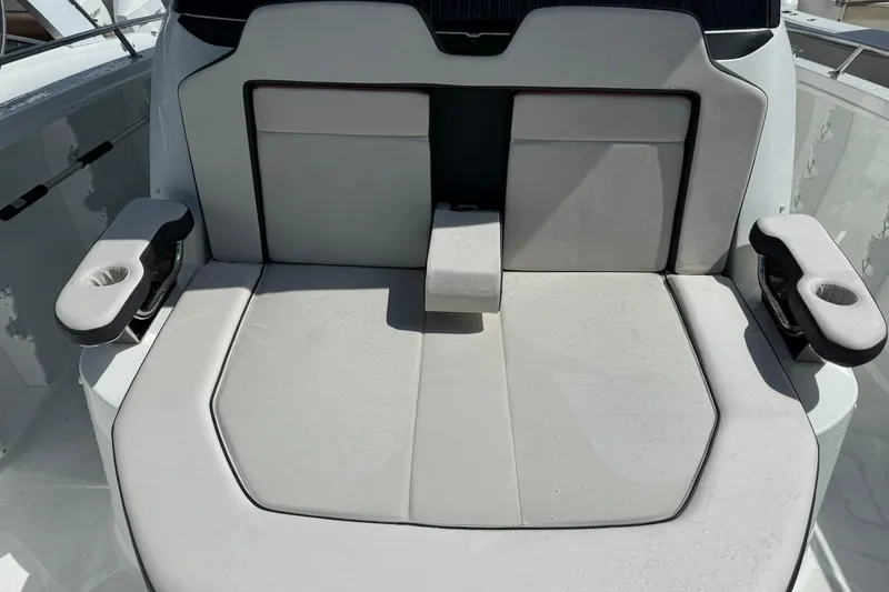 Slide: The Image of 2024 Jeanneau Leader 10.5 CC boat seating with cup holders and armrests. - 19