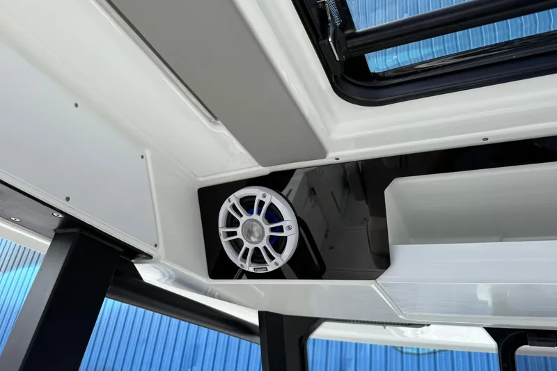 Slide: The Image of 2024 Jeanneau Leader 10.5 CC interior speaker detail with modern design. - 27