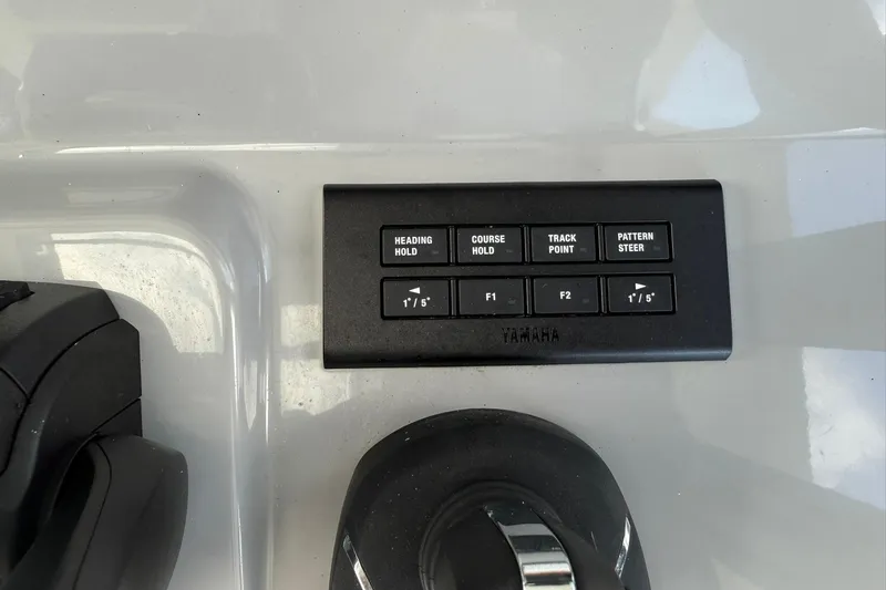 Slide: The Image of Control panel on 2024 Jeanneau Leader 10.5 CC boat with Yamaha navigation buttons. - 29