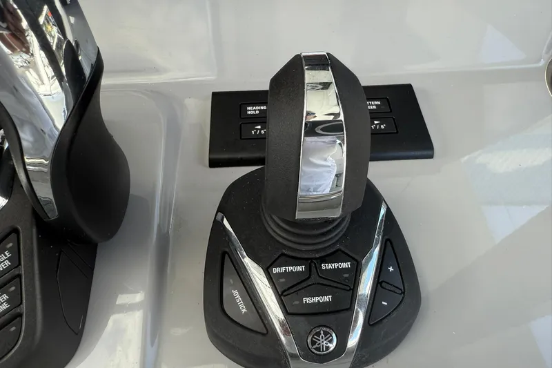 Slide: The Image of Joystick control panel on 2024 Jeanneau Leader 10.5 CC boat dashboard. - 30