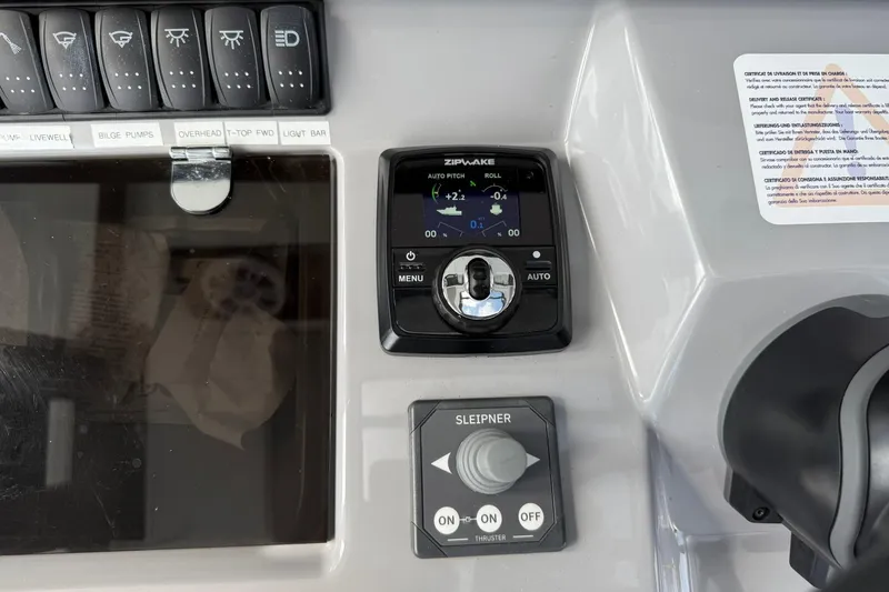 Slide: The Image of Control panel of 2024 Jeanneau Leader 10.5 CC boat with switches and display. - 33