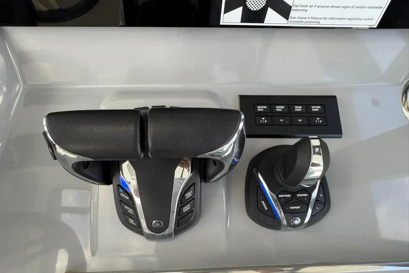 Slide: The Image of 2024 Jeanneau Leader 10.5 CC helm controls with advanced navigation features. - 34