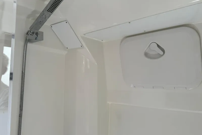Slide: The Image of 2024 Jeanneau Leader 10.5 CC interior shower area with modern fixtures. - 43