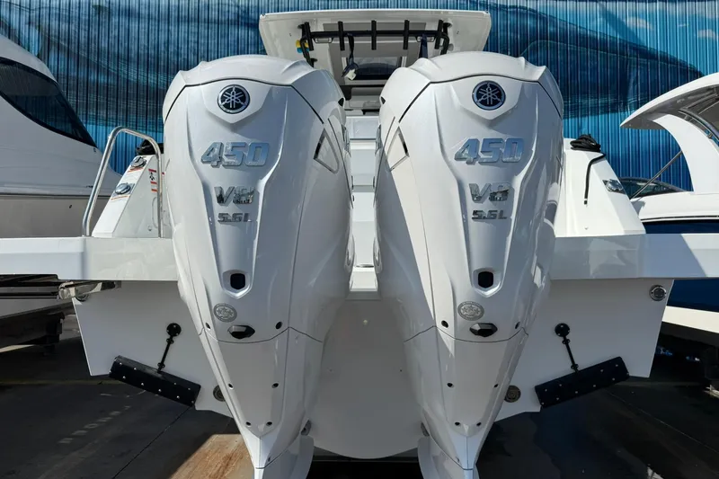 Slide: The Image of 2024 Jeanneau Leader 10.5 CC with twin Yamaha 450 V8 engines, rear view. - 7
