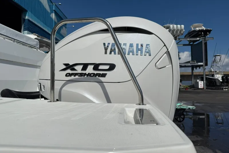 Slide: The Image of 2024 Jeanneau Leader 10.5 CC with Yamaha XTO Offshore engine at marina. - 9