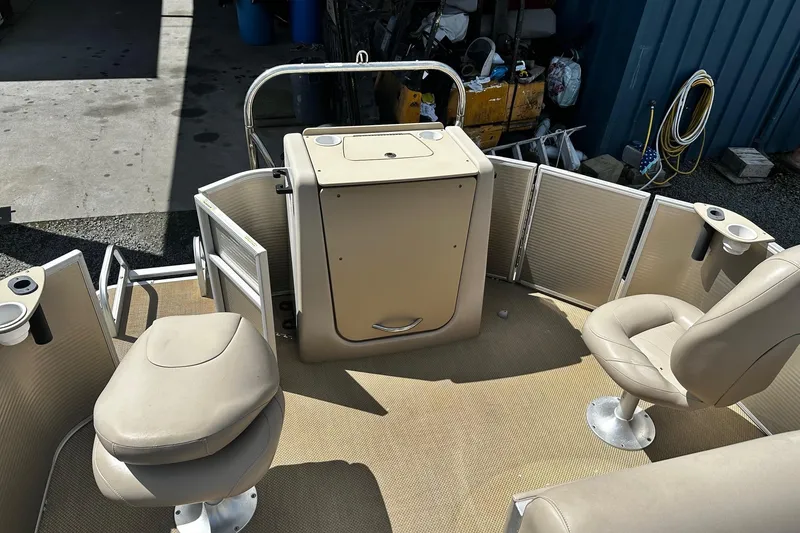 Slide: The Image of 2015 Godfrey Sweetwater PE 220 DLX Fish Coastal boat interior with seating and storage. - 10