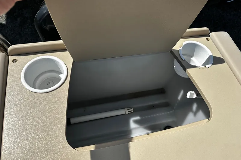 Slide: The Image of Open storage compartment on 2015 Godfrey Sweetwater PE 220 DLX Fish Coastal boat. - 14