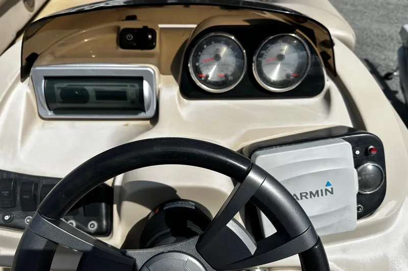 Slide: The Image of Dashboard of 2015 Godfrey Sweetwater PE 220 DLX Fish Coastal with Garmin navigation. - 5