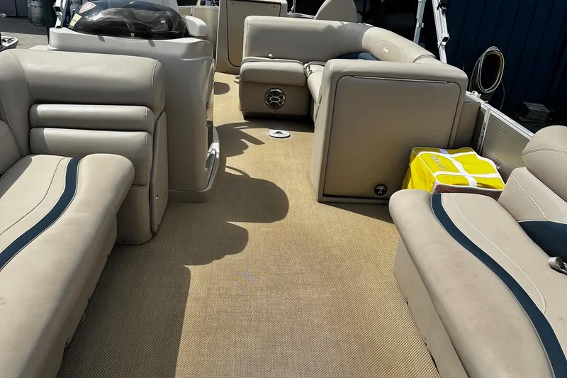 Slide: The Image of Interior of 2015 Godfrey Sweetwater PE 220 DLX Fish Coastal pontoon boat with beige seating. - 7