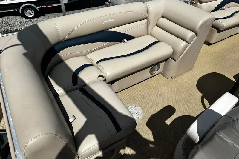 Slide: The Image of 2015 Godfrey Sweetwater PE 220 DLX Fish Coastal boat interior with beige seating. - 9
