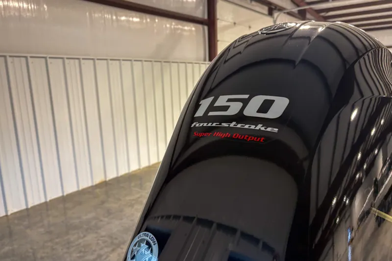 Slide: The Image of 2025 Skeeter ZX150 outboard motor, four-stroke, super high output, in a warehouse setting. - 9