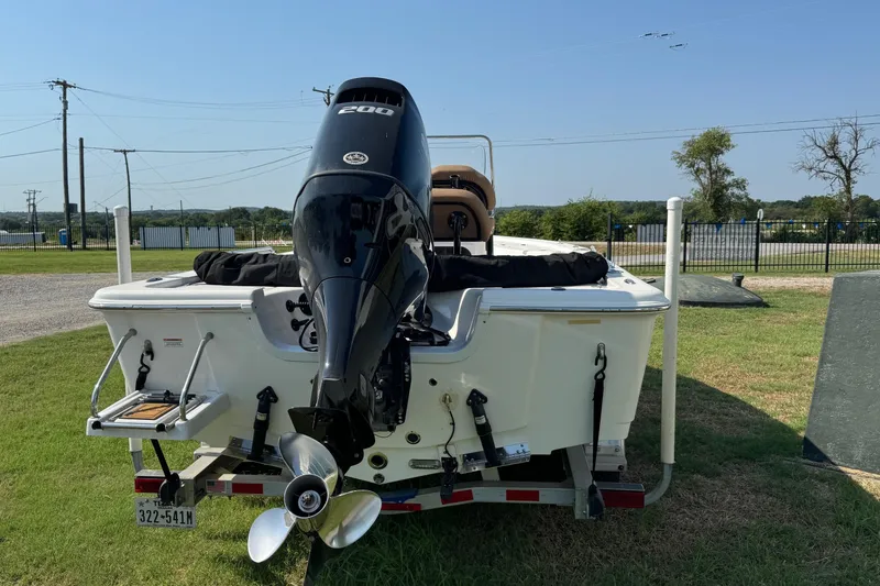 Slide: The Image of 2023 Sea Pro 208 Bay boat with powerful outboard motor on trailer. - 7