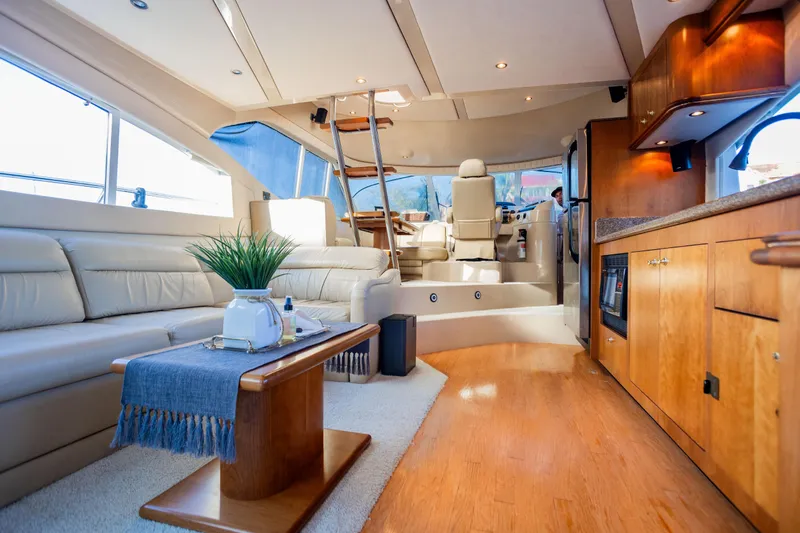 Slide: The Image of Luxurious interior of 2001 Cruisers Yachts 5000 Sedan Sport with elegant seating and modern amenities. - 13