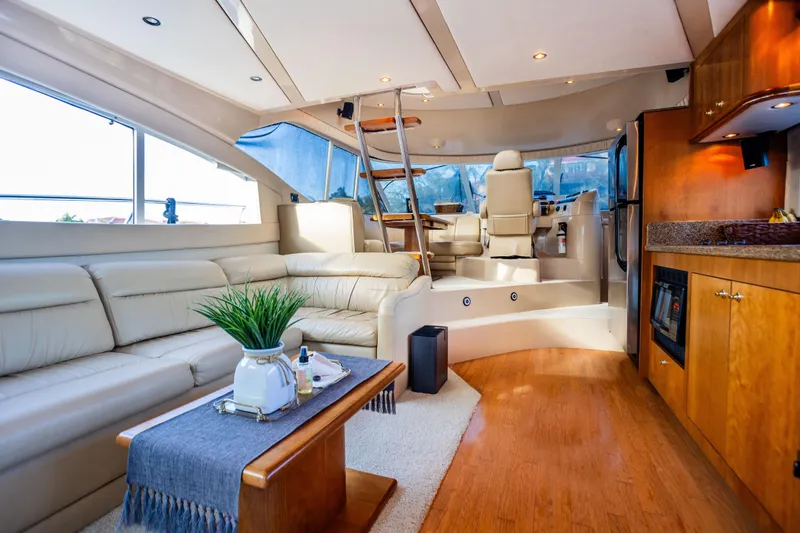 Slide: The Image of Luxurious interior of 2001 Cruisers Yachts 5000 Sedan Sport with elegant seating and modern amenities. - 14