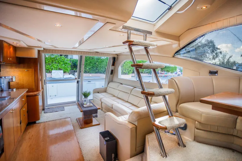 Slide: The Image of Luxurious interior of 2001 Cruisers Yachts 5000 Sedan Sport with plush seating and modern design. - 18