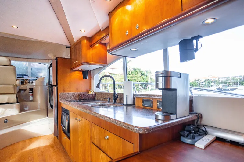 Slide: The Image of Luxurious kitchen interior of 2001 Cruisers Yachts 5000 Sedan Sport with modern amenities. - 20