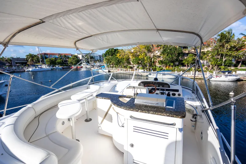 Slide: The Image of Luxurious 2001 Cruisers Yachts 5000 Sedan Sport with spacious deck and scenic marina view. - 42