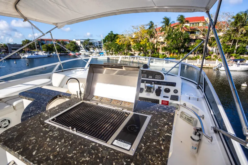 Slide: The Image of 2001 Cruisers Yachts 5000 Sedan Sport with outdoor grill and marina view. - 46