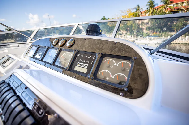 Slide: The Image of 2001 Cruisers Yachts 5000 Sedan Sport dashboard with gauges and controls. - 50