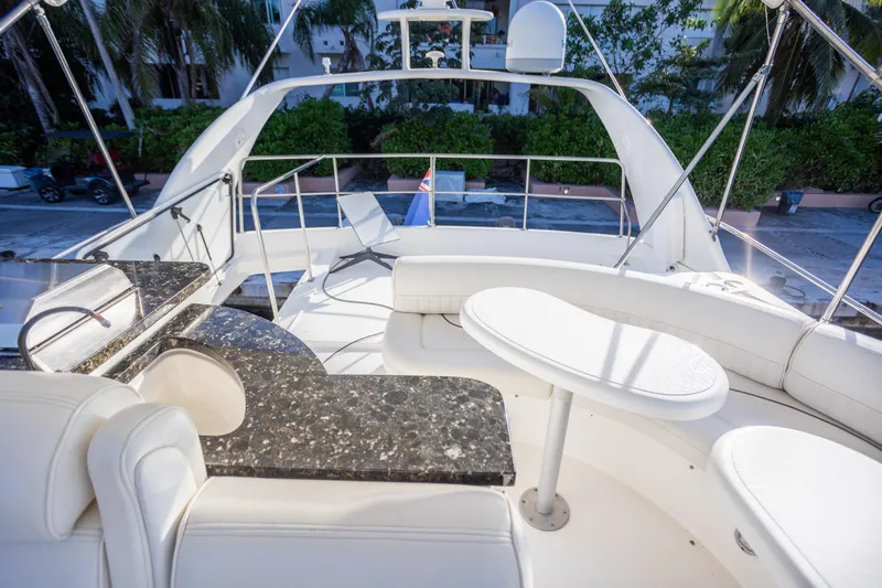 Slide: The Image of Luxurious 2001 Cruisers Yachts 5000 Sedan Sport with elegant seating and sleek design. - 54