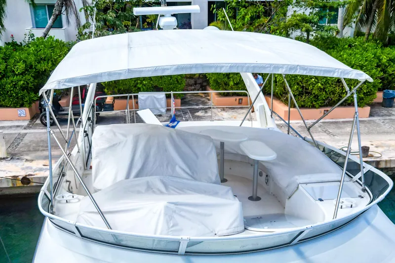 Slide: The Image of 2001 Cruisers Yachts 5000 Sedan Sport with covered seating area and canopy. - 69