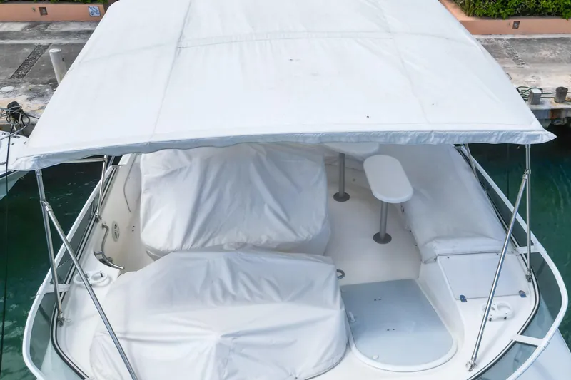 Slide: The Image of 2001 Cruisers Yachts 5000 Sedan Sport with covered seating area and canopy. - 70