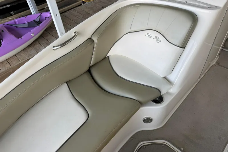Slide: The Image of 2006 Sea Ray 240 Sundeck boat seat with beige and white upholstery. - 10